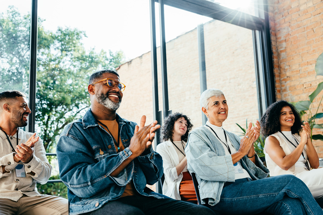 People applauding at a seminar