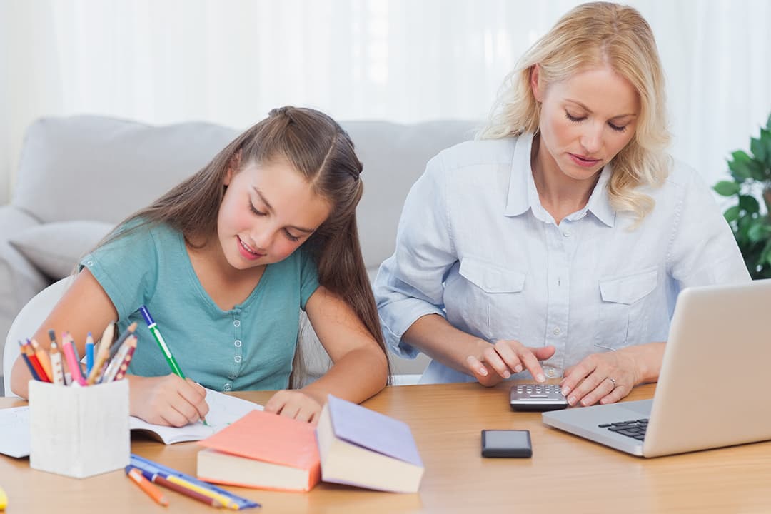 Mum calculator daughter writing