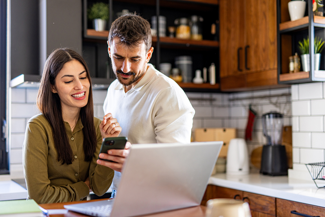 Couple with phone laptop