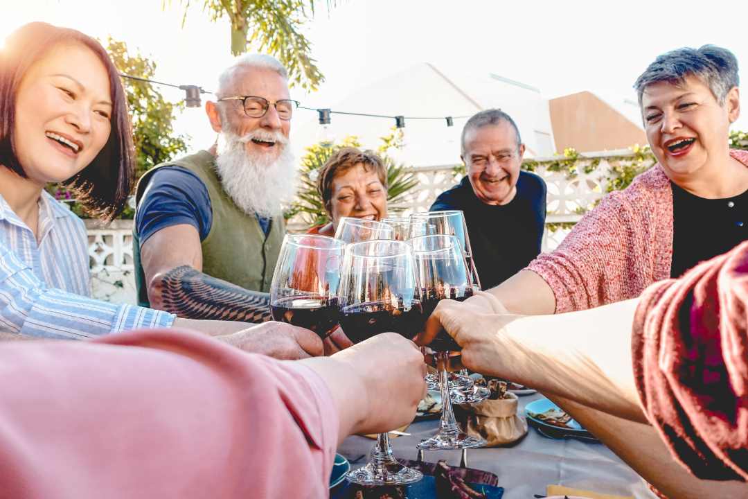 Group of retirees celebrating outdoors 