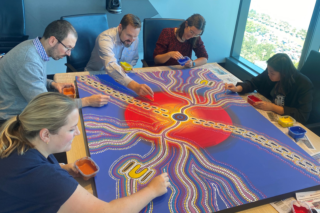 GESB staff contributing to Beverley Egan’s ‘Bush potato dreaming’ painting