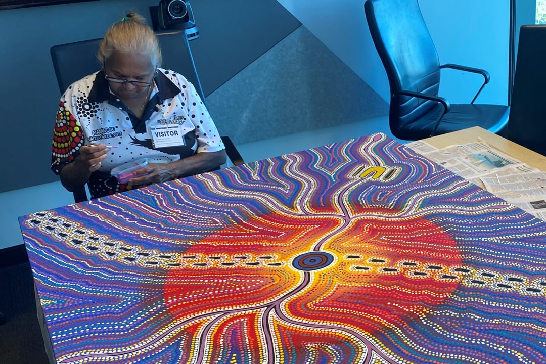 Yamatji artist Beverley Egan instructing GESB staff in Aboriginal art techniques